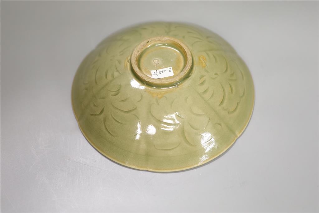 A Chinese carved celadon dish, 18.5cm diameter